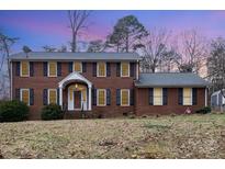 Brick house with a two-car garage and well-maintained lawn at 330 Regency Rd, Salisbury, NC 28147