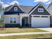 Gray and white two-story house with a two-car garage and landscaping at 5775 Crown Ter, Hickory, NC 28601