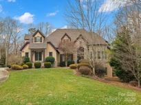 Elegant two-story home with stone accents and landscaped lawn at 9117 Monarchos Ct, Waxhaw, NC 28173