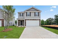 Two-story house with gray siding, stone accents, and a two-car garage at 1020 20Th Avenue Se Way, Hickory, NC 28602