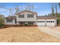 Gray house with two-car garage and landscaping at 10414 Club Car Ct, Mint Hill, NC 28227