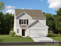 Two-story home with gray siding, white accents, and a two-car garage at 13131 Hampton Bay Ln, Charlotte, NC 28262