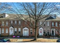 Brick townhouses with front yards and landscaping at 135 Singleton Rd, Mooresville, NC 28117