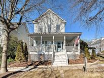 Charming two-story home with front porch and landscaped yard at 13713 Batemans Rd, Huntersville, NC 28078