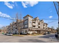 Attractive multi-unit building with grey siding and a charming design at 301 E Tremont Ave # 313, Charlotte, NC 28203