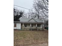 A charming one-story home with a front porch at 320 Southern St, East Spencer, NC 28039