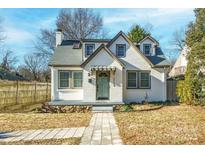 Charming two-story home with painted brick, inviting entryway and a well-maintained front yard at 3724 Commonwealth Ave, Charlotte, NC 28205