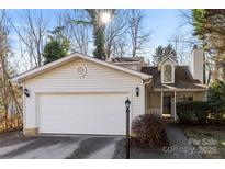 Updated two-story house with attached garage and landscaped yard at 5811 Rocky Mount Ct, Charlotte, NC 28214