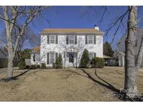 Charming two-story home with classic white siding, green shutters, and a well-manicured front lawn at 1687 Riverdale Dr, Rock Hill, SC 29732