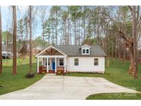 Craftsman style home with a front porch and driveway at 203 Bud Black Rd, Crouse, NC 28033