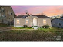 Charming single-story house with a well-maintained lawn at 2648 Roslyn Ave, Charlotte, NC 28208