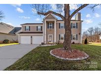 Two story house with large front yard and two car garage at 505 Viking Sw Dr, Concord, NC 28025