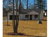 White house with black garage door and wood posts on front porch at 2045 Cordia Cir, Newton, NC 28658