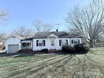 White house with a spacious yard, and attached garage at 350 Turnersburg Hwy, Statesville, NC 28625