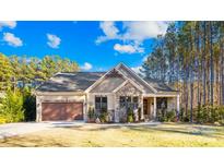 Craftsman style home with stone accents and a two-car garage at 137 Deer Run Dr, Troutman, NC 28166