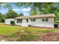 Newly renovated ranch home with a spacious front yard at 2697 Knotty Pine Dr, Lancaster, SC 29720