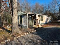 Single-wide mobile home with carport and spacious yard at 4126 Oxford School Rd, Catawba, NC 28609