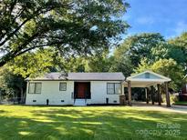 Charming ranch home with a carport and well-manicured lawn at 808 Eastview St, Shelby, NC 28152