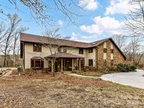 Two-story house with stone accents and a large covered porch at 955 Brafford Dr, Concord, NC 28025