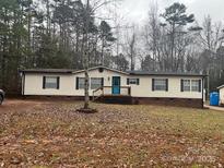 Single-wide mobile home with a spacious yard at 104 Freeze Meadow Rd, China Grove, NC 28023