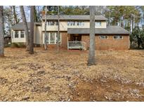 Two-story brick house with wood siding and a large deck at 69 Honeysuckle Woods, Clover, SC 29710