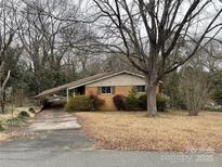 Ranch style house with brick facade and carport at 1108 Cone Ave, Pineville, NC 28134