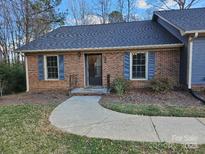 Brick ranch home with a covered entry and landscaped yard at 240 Pointe Cir # 240, Rock Hill, SC 29732