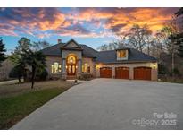 Brick house with three-car garage, and landscaping at 3917 Acacia N Rd, York, SC 29745