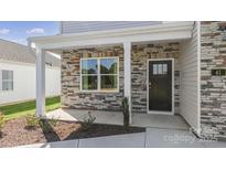 Two-story house with stone accents and a covered porch at 4618 Harris Elliot Rd, Lincolnton, NC 28092