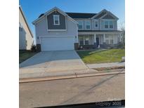 Two-story house with gray siding, brick accents, and a two-car garage at 545 Shallowford Dr, Rock Hill, SC 29732