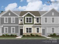 Two-story townhome with green accents and gray siding at 9863 Old Garden Cir, Gastonia, NC 28056