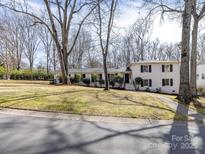 Charming single-Gathering home with traditional architecture, mature trees, and inviting curb appeal at 1116 Circlewood Dr, Charlotte, NC 28211