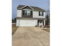 Two-story house with a white and gray exterior, a double garage, and landscaping at 155 Trail Wood Ct, Salisbury, NC 28146