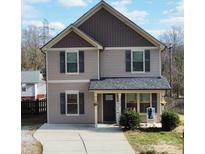 Two-story house with gray siding, dark brown accents, and a front porch at 212 Old Centergrove Rd # 111, Kannapolis, NC 28083