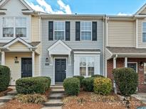 Gray townhome with black shutters and landscaping at 3102 Windsor Trace Dr, Fort Mill, SC 29707