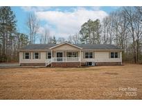 Single-story house with a covered porch and a spacious lawn at 421 Pineland Ct, Catawba, SC 29704