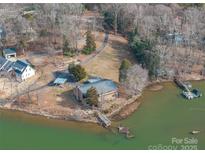 Aerial view of waterfront property with expansive lake views and private dock at 1408 Gaither Rd, Belmont, NC 28012