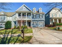 Two-story home with blue siding, white trim, and a two-car garage at 2008 Fallondale Rd, Waxhaw, NC 28173