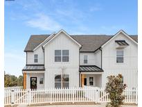 White farmhouse-style townhome with a white picket fence at 478 Berryman Rd, Rock Hill, SC 29732