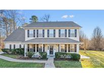 Two-story house with front porch and landscaping at 507 Bearbrook Ln, Gastonia, NC 28052