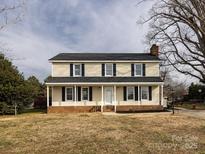 Charming two-story home featuring a covered front porch and traditional design elements at 509 Baucom Deese Rd, Monroe, NC 28110