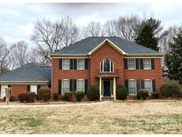 Brick two-story house with a large front yard and mature trees at 536 19Th Avenue Nw Dr, Hickory, NC 28601