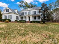 Two-story house with white siding, black shutters, and a large front yard at 208 Grasshopper Cir, Mooresville, NC 28117