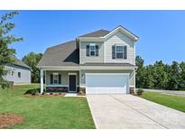 Two-story house with gray siding, stone accents, and a two-car garage at 2226 Catawba Trace Dr, Catawba, NC 28609