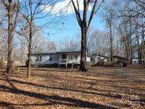Ranch style home with carport and spacious yard at 401 Gillscreek Dr, Lancaster, SC 29720