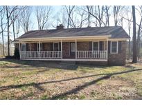 Ranch home with covered porch and large yard at 1008 E Sandy Ridge Rd, Monroe, NC 28112