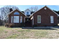 Brick ranch house with a large front yard and mature trees at 1044 Tarlton Dr # 0, Shelby, NC 28052