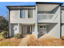 Updated townhome exterior boasts new siding and landscaping at 11212 Carmel Chace Dr # 101, Charlotte, NC 28226