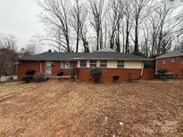 Brick ranch house with a spacious yard at 3103 Minnesota Rd, Charlotte, NC 28208