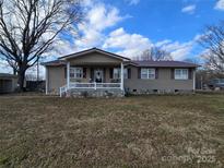 Ranch home with covered porch and stone accents at 535 Springs East Rd, Lincolnton, NC 28092